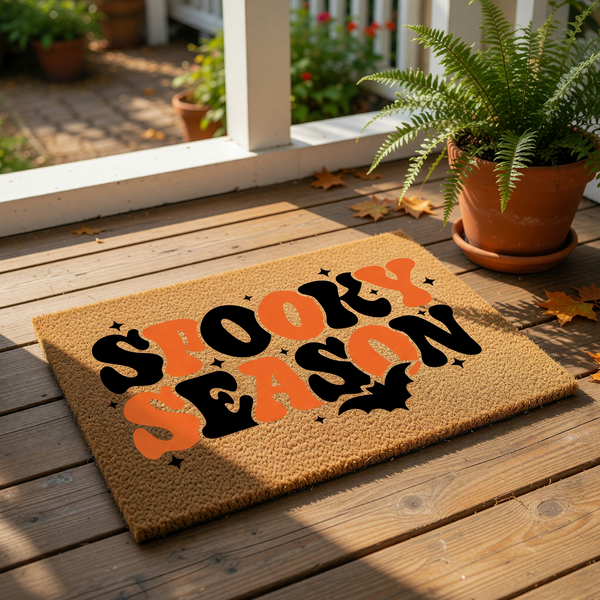 a textured door mat with the text "SPOOKY SEASON" printed on it in a stylized font.