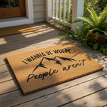 a textured area rug with a mountain silhouette and the phrase "I WANNA BE WHERE People aren't" printed on it.