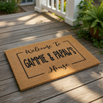 a welcome mat with the text "Welcome to Gammie & Papaw's House" written on it.