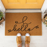 a door mat with the word hello written on it