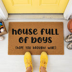 a door mat that says house full of boys hope you brought wine
