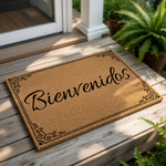 A cork door mat with the word "Bienvenidos" written on it, placed on a tiled floor next to a potted plant.