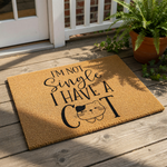 a door mat with a humorous text that reads "I'm not single, I have a cat" along with a cat illustration.