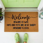a welcome mat that says, welcome beware of wife kids and pets are also