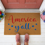 a door mat that says america y'all on it