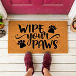 a door mat that says wipe your paws