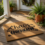 A door mat with the text "Chaos Coordinator" printed on it.