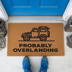 a door mat that says probably overlanding with a truck on it