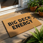 A textured doormat with the phrase "BIG DECK ENERGY" printed on it.