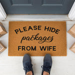 a door mat that says please hide packages from wife