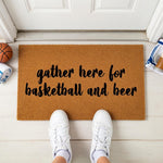 a door mat that says gather here for basketball and beer