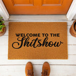 a welcome mat that says welcome to the shitshow