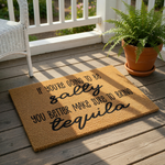 a humorous text that reads "If you're going to be salty, you better make sure to bring tequila" on a doormat.