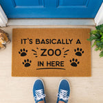 a door mat that says it's basically a zoo in here