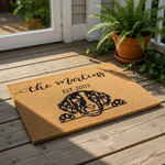 A rectangular, beige-colored doormat with a black and white illustration of a dog's face and paw prints.