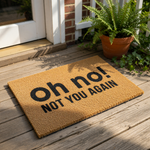 A textured doormat with the phrase "oh no!