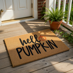 A textured door mat with the words "HELL PUMPKIN" printed on it, along with an orange pumpkin icon.