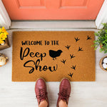a welcome mat that says welcome to the pee show