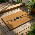 A beige textured area rug with a black line design depicting the phases of the moon.