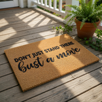 a textured area rug with the phrase "DON'T JUST STAND THERE BUST A MOVE" printed on it.