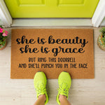 a door mat that says she is beauty she is grace