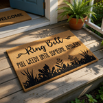 A door mat with the text "Ring Bell" and the phrase "Pull weeds until someone answers" printed on it.