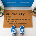a door mat that says auda city on it