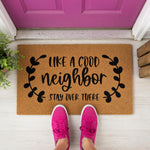 a door mat that says, like a good neighbor stay over there