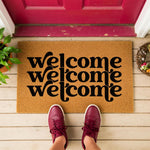 a welcome mat with the words welcome on it