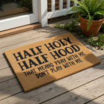 A textured area rug with the phrase "Half Holy Hood" printed on it.