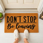 a door mat that says don't stop be leaving