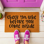 a door mat that says check you vibe before you come inside