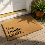 A beige doormat with the text "Live.