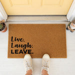 a door mat that says live laugh leave