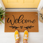 a welcome mat hanging on the side of a door