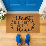 a door mat that says christ is the head of this home