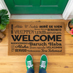 a welcome mat is hanging on a wall
