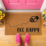 a welcome mat with a picture of a bee on it