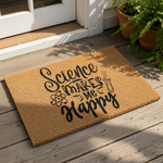 A textured area rug with the phrase "Science makes me happy" printed on it, along with a small illustration of a laboratory setting.