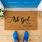 a door mat that says ask god not google