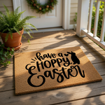 Hoppy Easter doormat featuring a cute bunny silhouette and festive typography on a natural coir fiber welcome mat, perfect for spring porch decor and seasonal entryway floor mats to greet guests during the holiday celebration.