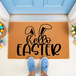 Hello Easter coir doormat with black bunny ears design, a festive spring welcome mat for front porch decor featuring colorful eggs and tulips in a bright entryway setting for seasonal home entrance styling and holiday floor