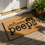 Easter welcome doormat featuring the text welcome peeps with three black bunny silhouettes on a natural coir fiber mat, perfect for spring porch decor, front door entryways, and seasonal home entrance floor mats for guests.