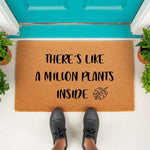 Plant lover doormat with funny text that reads there is like a million plants inside, featuring a monstera leaf design on natural coir fiber.