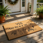 Plant lover doormat with funny text Yes I Really Need All Of These Plants and black line art illustrations of various potted succulents and hanging greenery on a natural coir welcome mat for front porch home decor and entryway