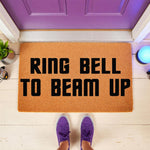 Funny science fiction welcome doormat with the text Ring Bell To Beam Up, featuring a natural coir fiber mat on a porch floor with purple sneakers, perfect for a geeky home entrance or a unique housewarming gift for sci-fi fans.