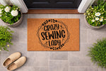 Crazy Sewing Lady doormat for front porch, a natural coir welcome mat featuring black text and sewing machine icons, perfect for a craft room entrance or a fun housewarming gift for a hobbyist who loves quilting and sewing