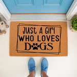 Dog lover doormat with Just A Girl Who Loves Dogs text and a paw print design, featuring a natural coir fiber welcome mat for front porch decor that makes a fun housewarming present for any pet owner or canine enthusiast.