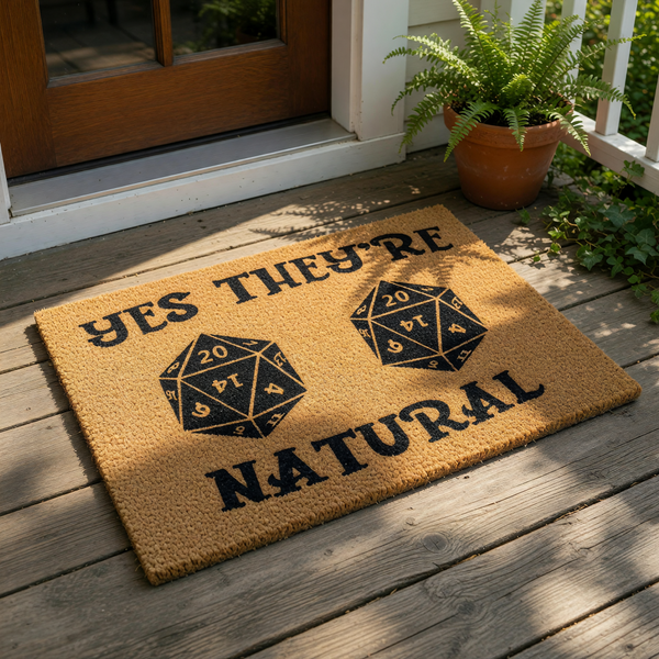 Tabletop gaming doormat featuring two twenty-sided dice and the text Yes They're Natural, a funny welcome mat for gamers, nerds, and fantasy fans made of durable coir fiber for your front porch, entryway, or home decor entrance.