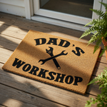Dad's Workshop coir doormat featuring a black printed design of crossed wrenches, this durable outdoor welcome mat is a functional floor rug for a garage, man cave, or home workshop entrance for any handy father or DIY enthusiast.